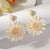Hand-woven Raffia Sun Flower Dangle Earrings thumbnail